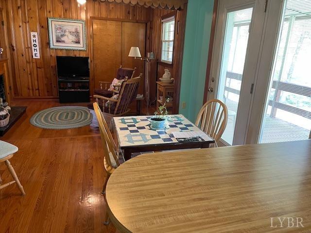 2393 Grit Road Hurt, VA 24563 - Photo 16 of 22 a bedroom with a bed and a table with wooden floor