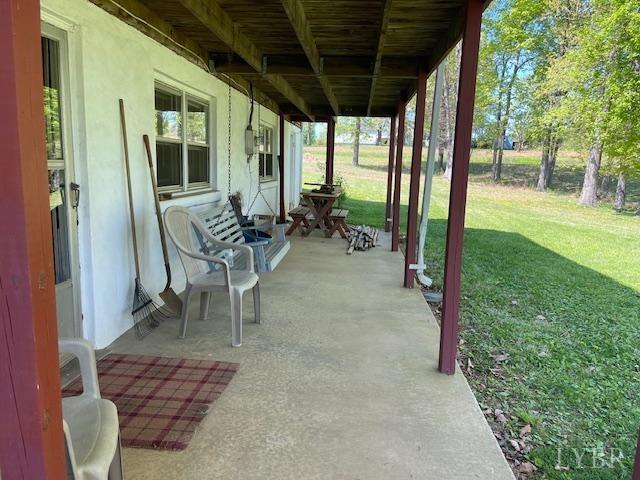 2393 Grit Road Hurt, VA 24563 - Photo 5 of 22 a view of a porch with chairs and backyard
