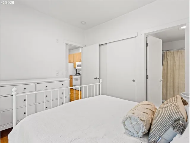 a bedroom with a bed and a dresser