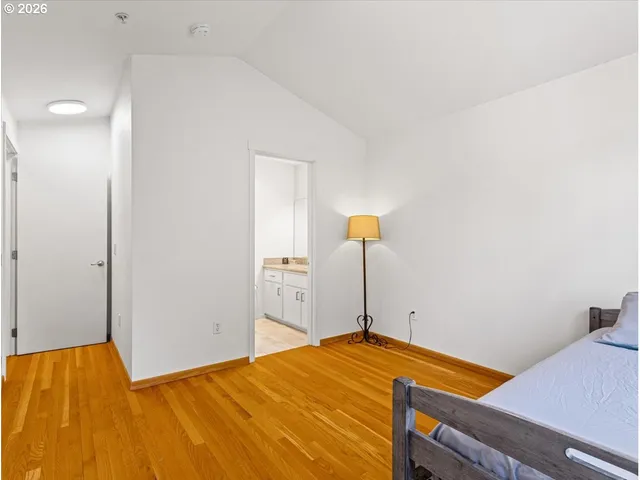 a bedroom with a bed and a table