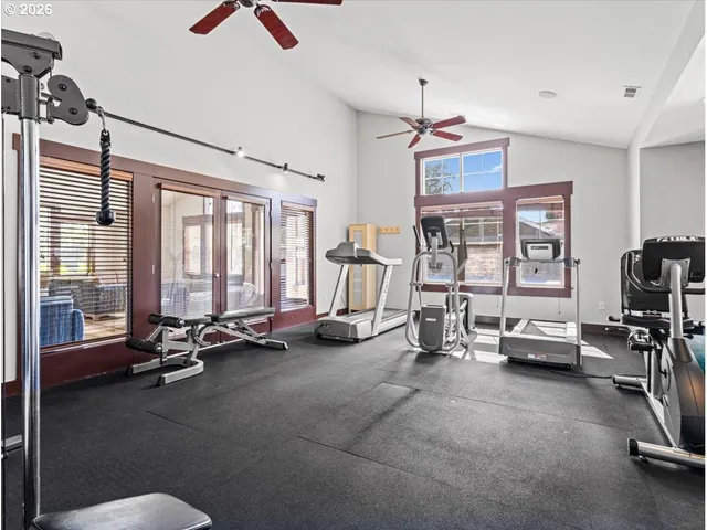 a view of a livingroom with workspace and a window