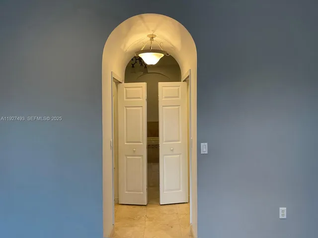 a bathroom with a granite countertop sink a mirror and a shower