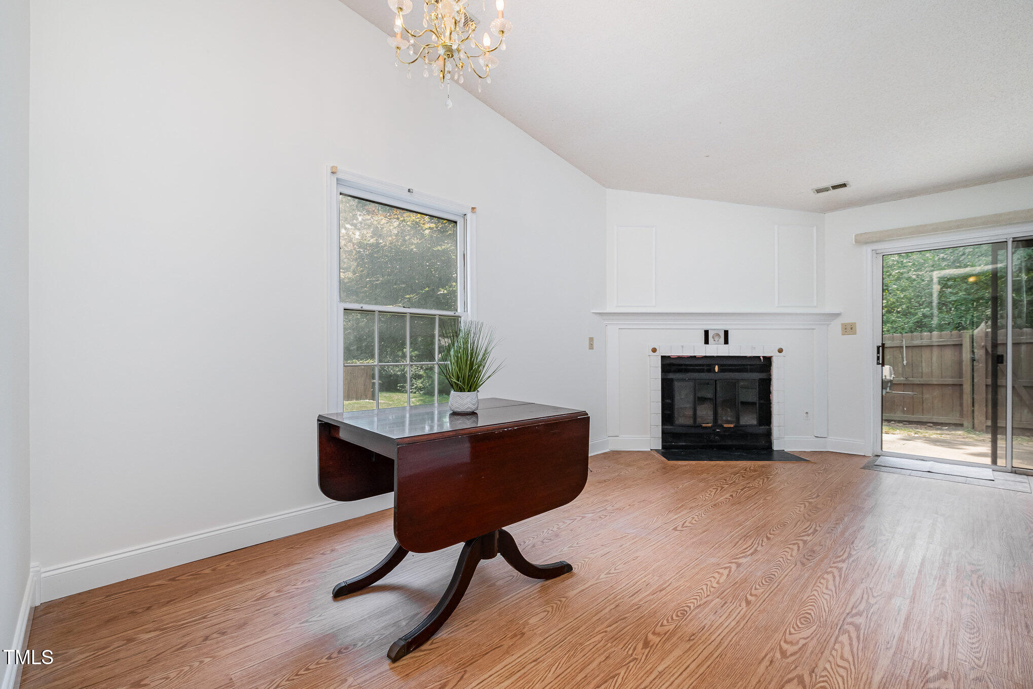 2213 Alpine Road Durham, NC 27707 - Photo 6 of 18 a living room with furniture and a fireplace