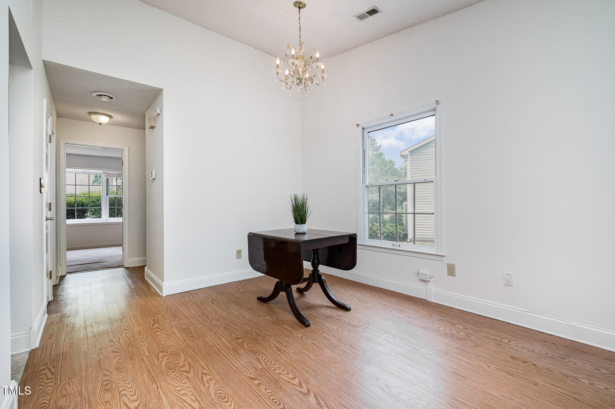 2213 Alpine Road Durham, NC 27707 - Photo 7 of 18 a view of a workspace with furniture and a window