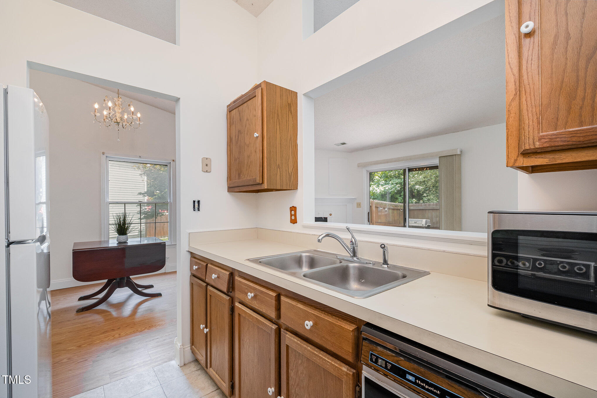 2213 Alpine Road Durham, NC 27707 - Photo 9 of 18 a kitchen with a sink and a stove top oven