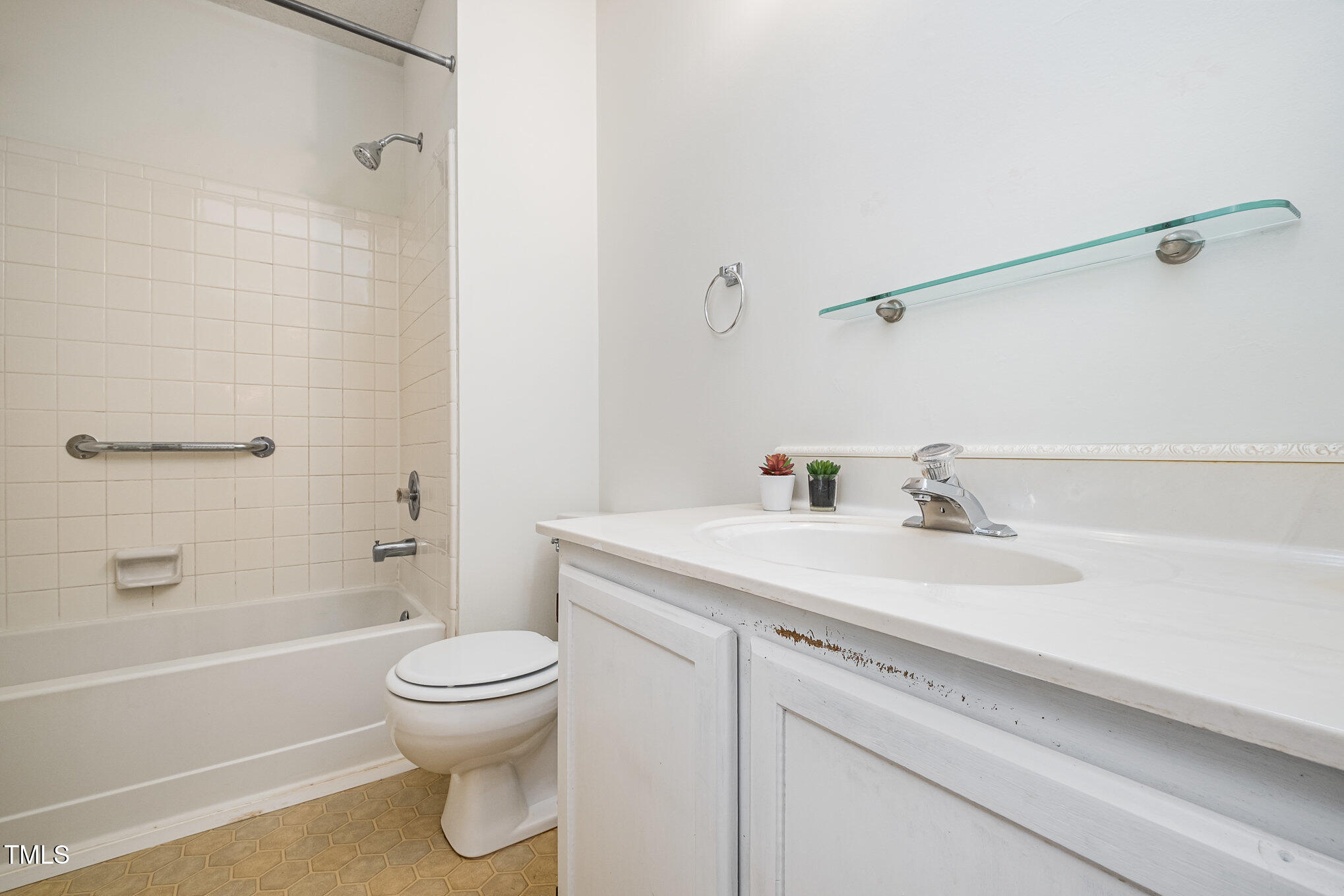 2213 Alpine Road Durham, NC 27707 - Photo 10 of 18 a bathroom with a sink a toilet and a bathtub