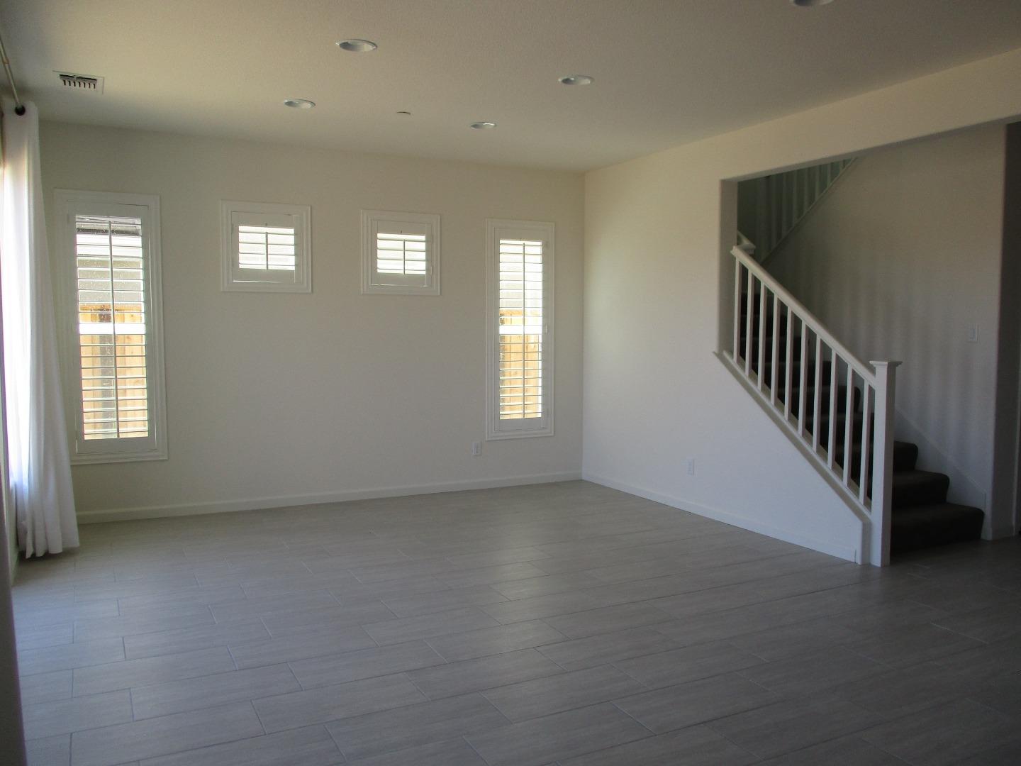 1027 Ruby Way Gilroy, CA 95020 - Photo 11 of 25 an empty room with windows