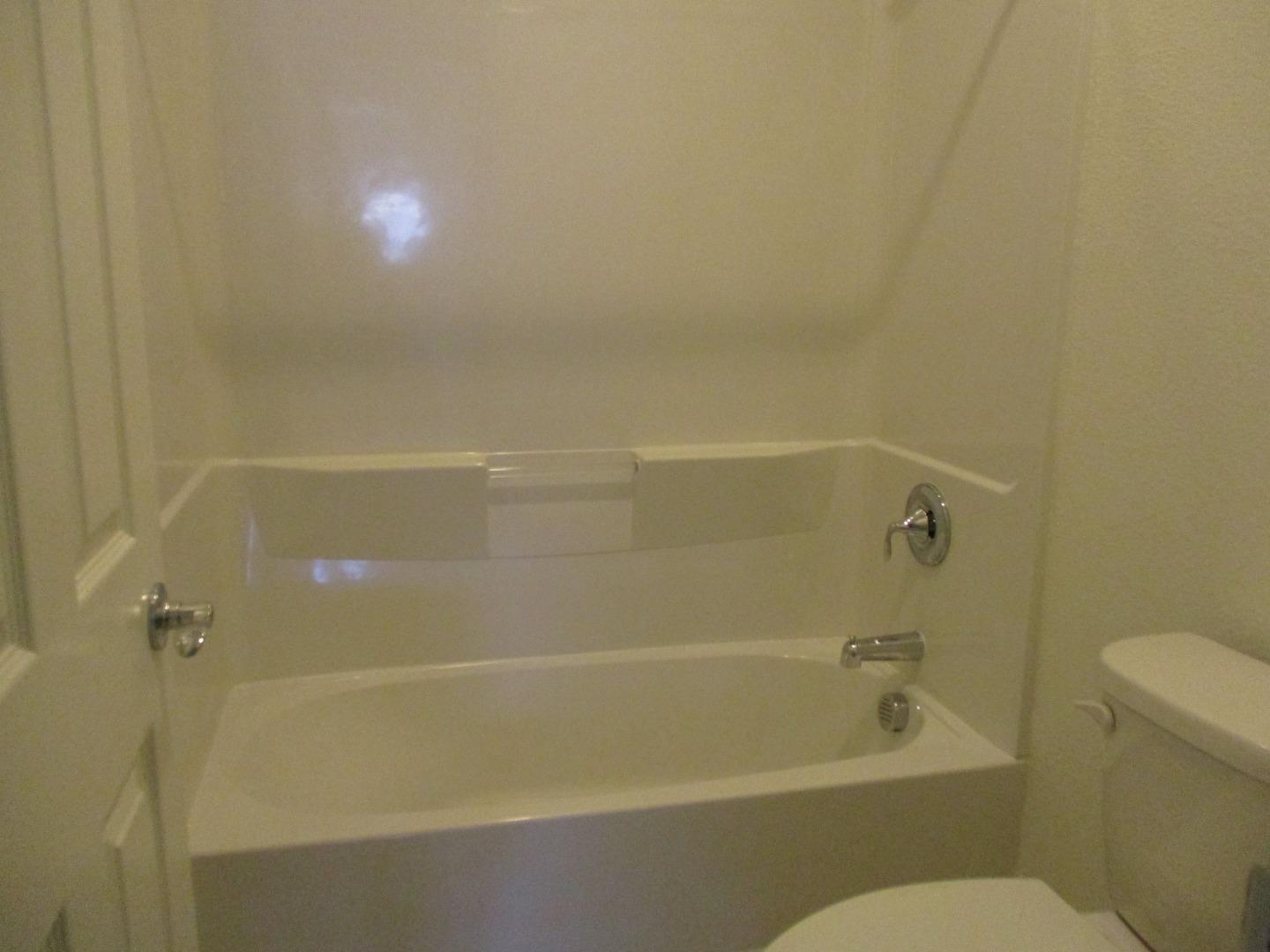 1027 Ruby Way Gilroy, CA 95020 - Photo 20 of 25 a bathroom with a shower and a toilet