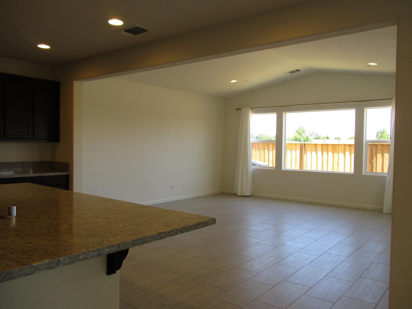 1027 Ruby Way Gilroy, CA 95020 - Photo 9 of 25 a view of an empty room with a window