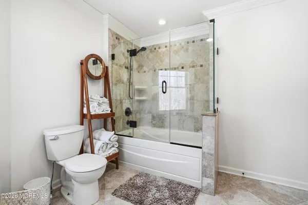 a spacious bathroom with a double vanity sink and a mirror