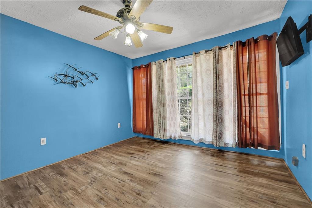 3285 Howell Circle Duluth, GA 30096 - Photo 12 of 33 an empty room with wooden floor and windows