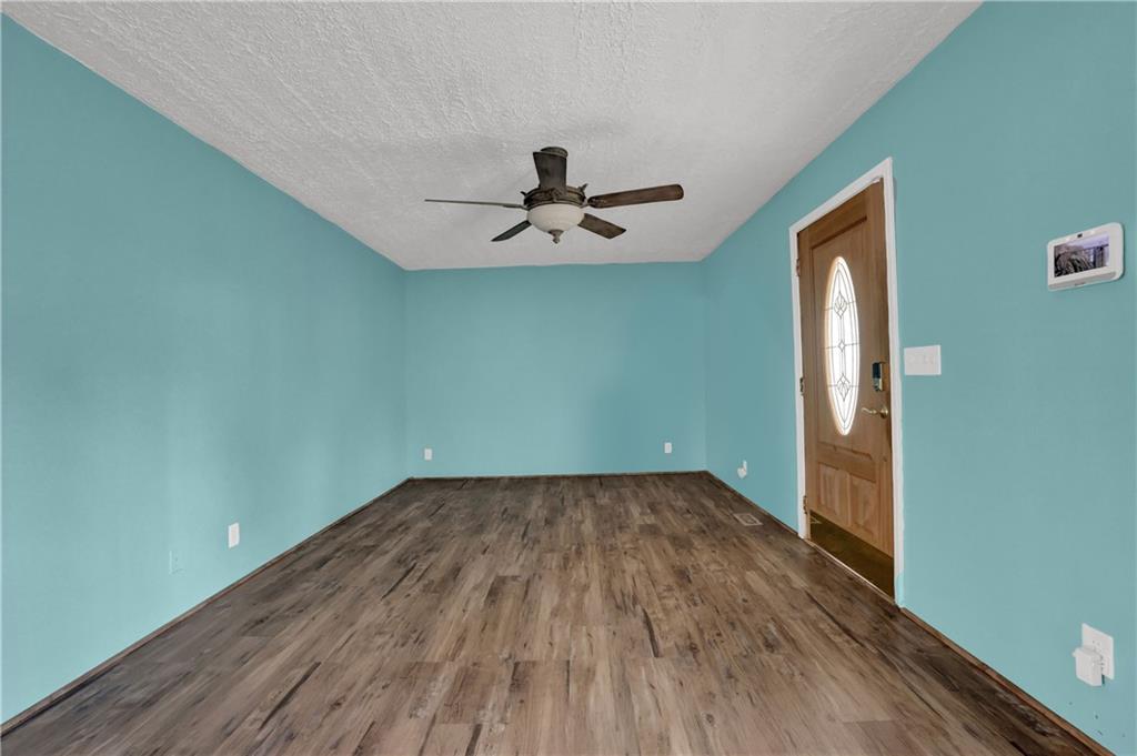 3285 Howell Circle Duluth, GA 30096 - Photo 3 of 33 wooden floor in an empty room with a window