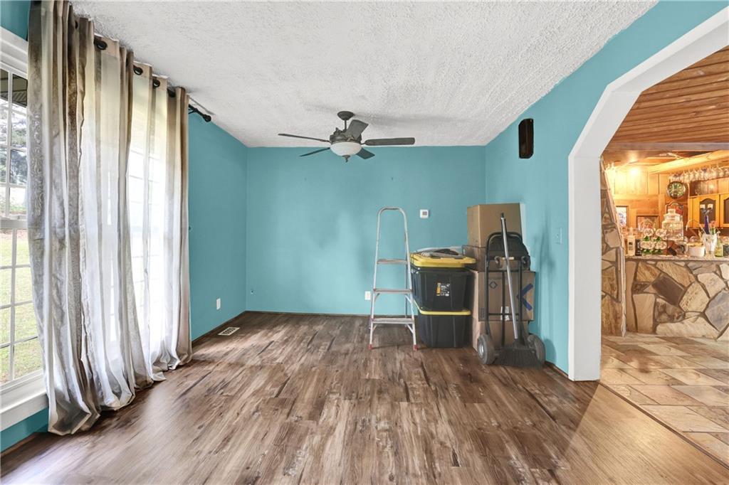 3285 Howell Circle Duluth, GA 30096 - Photo 4 of 33 wooden floor in an empty room with a window