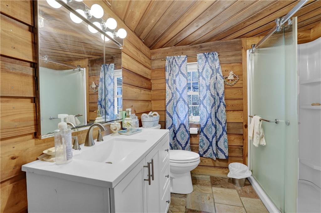 3285 Howell Circle Duluth, GA 30096 - Photo 8 of 33 a bathroom with a sink toilet and shower