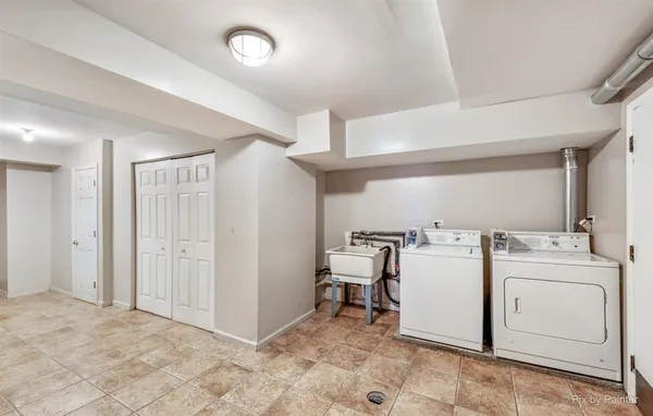 a view of a storage & utility room with washer and dryer