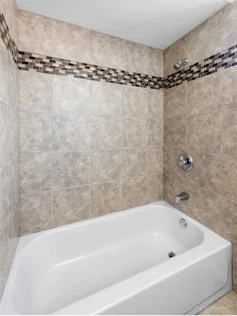 a bathroom with a shower and a bathtub