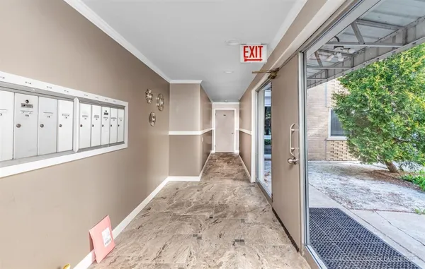 a view of a hallway with windows