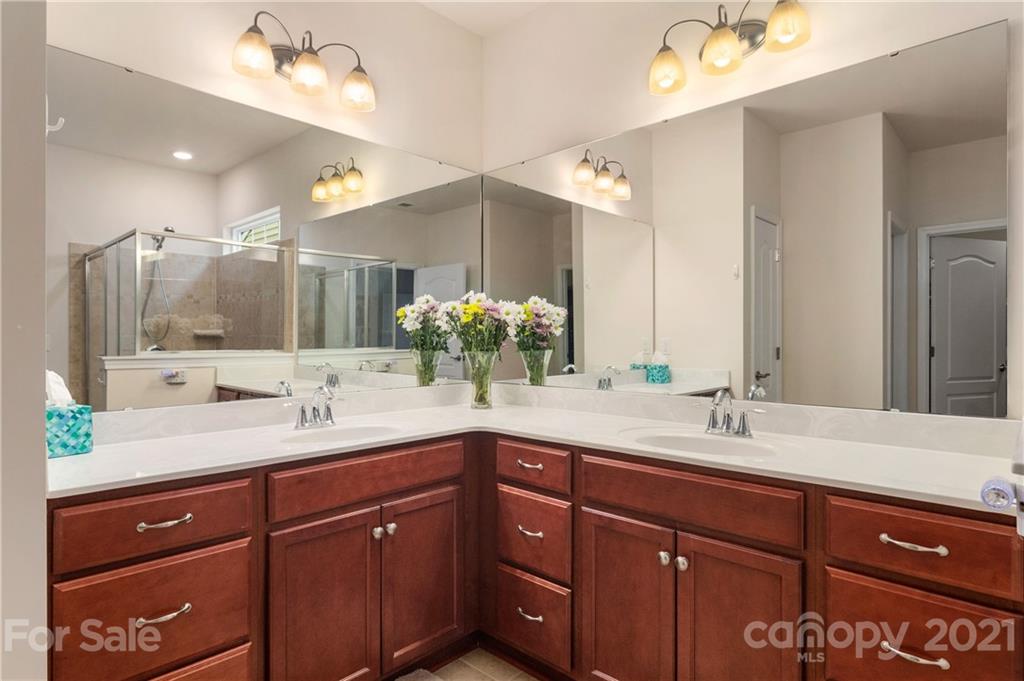 4205 Perth Road, Unit 351 Indian Land, SC 29707 - Photo 22 of 35 a bathroom with double vanity sinks and a large mirror