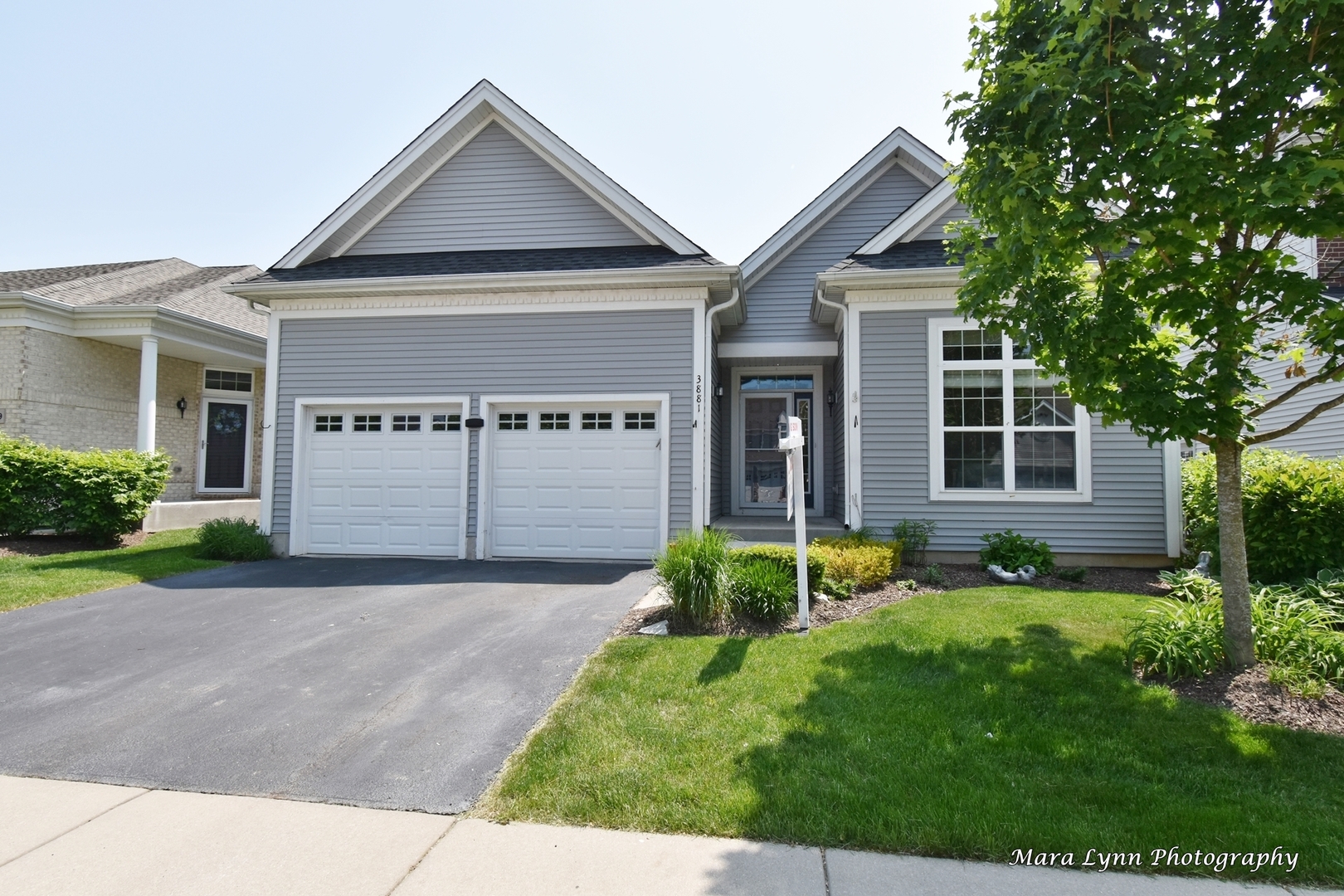 3881 Valhalla Drive Elgin, IL 60124 - Photo 1 of 39 a front view of a house with a yard and garage