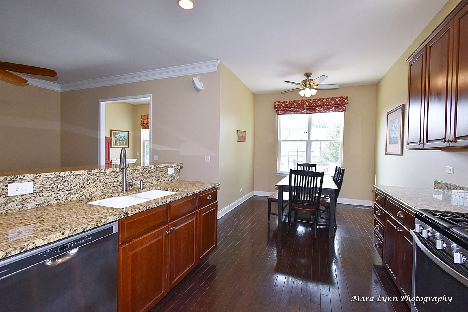 3881 Valhalla Drive Elgin, IL 60124 - Photo 12 of 39 a kitchen with granite countertop a dining table chairs and stove top oven