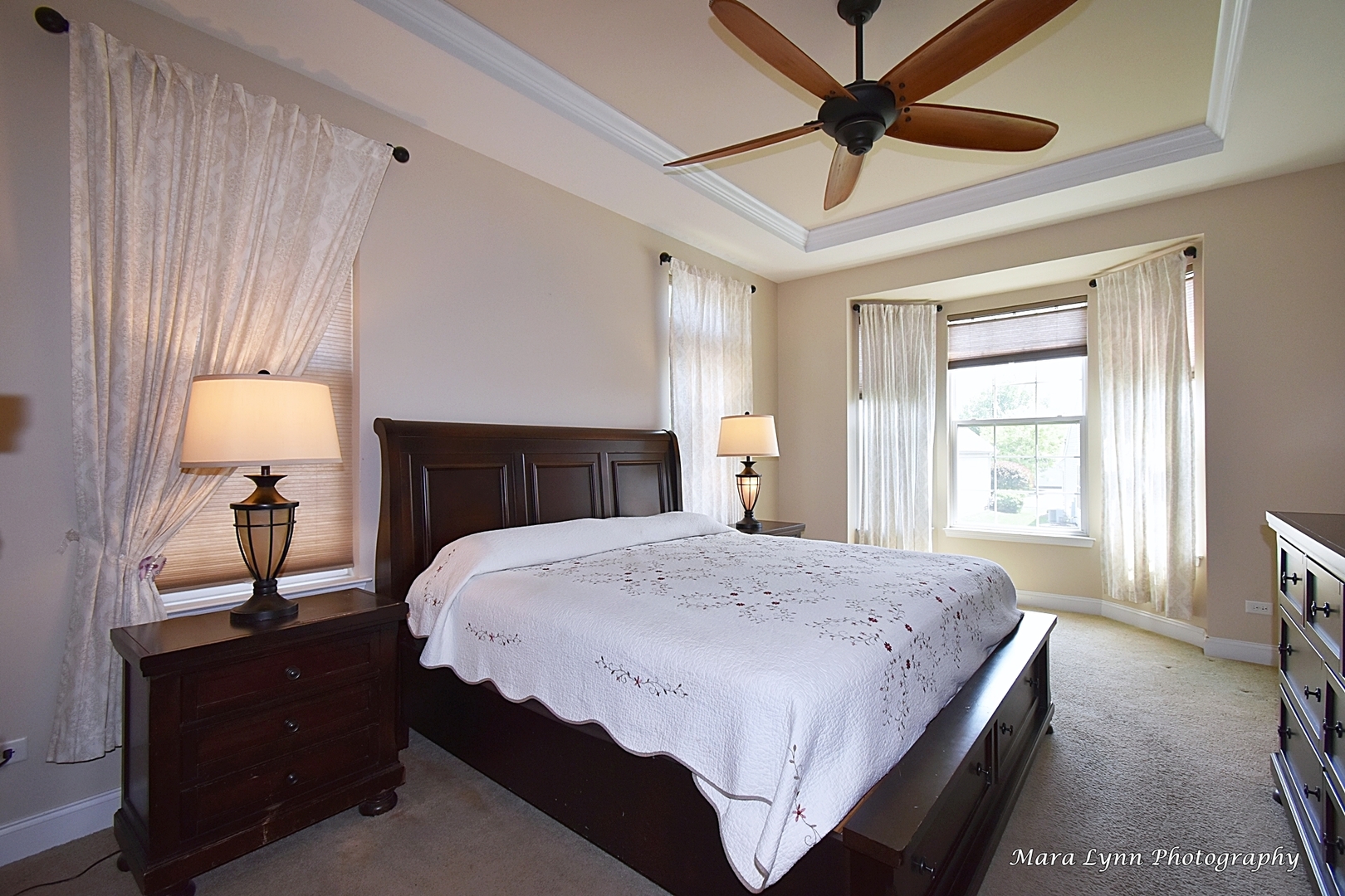 3881 Valhalla Drive Elgin, IL 60124 - Photo 20 of 39 a spacious bedroom with a bed and a chandelier