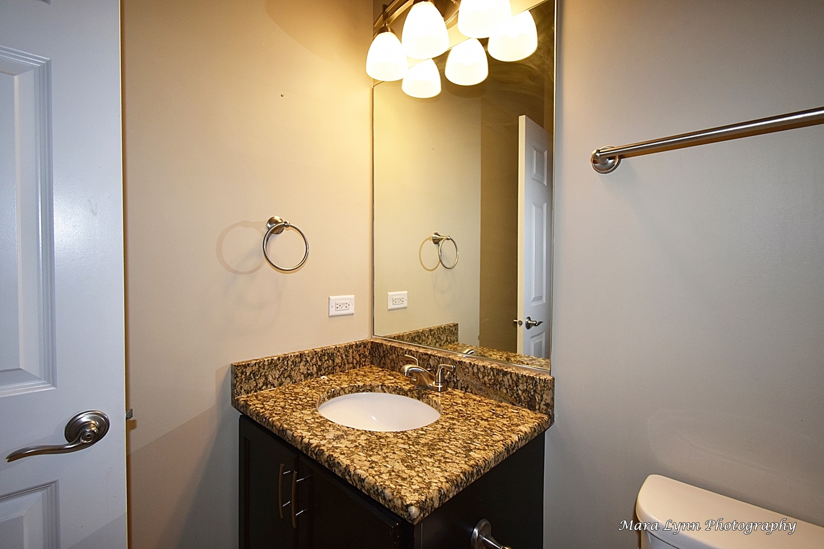 3881 Valhalla Drive Elgin, IL 60124 - Photo 25 of 39 a bathroom with a granite countertop sink a toilet and a mirror