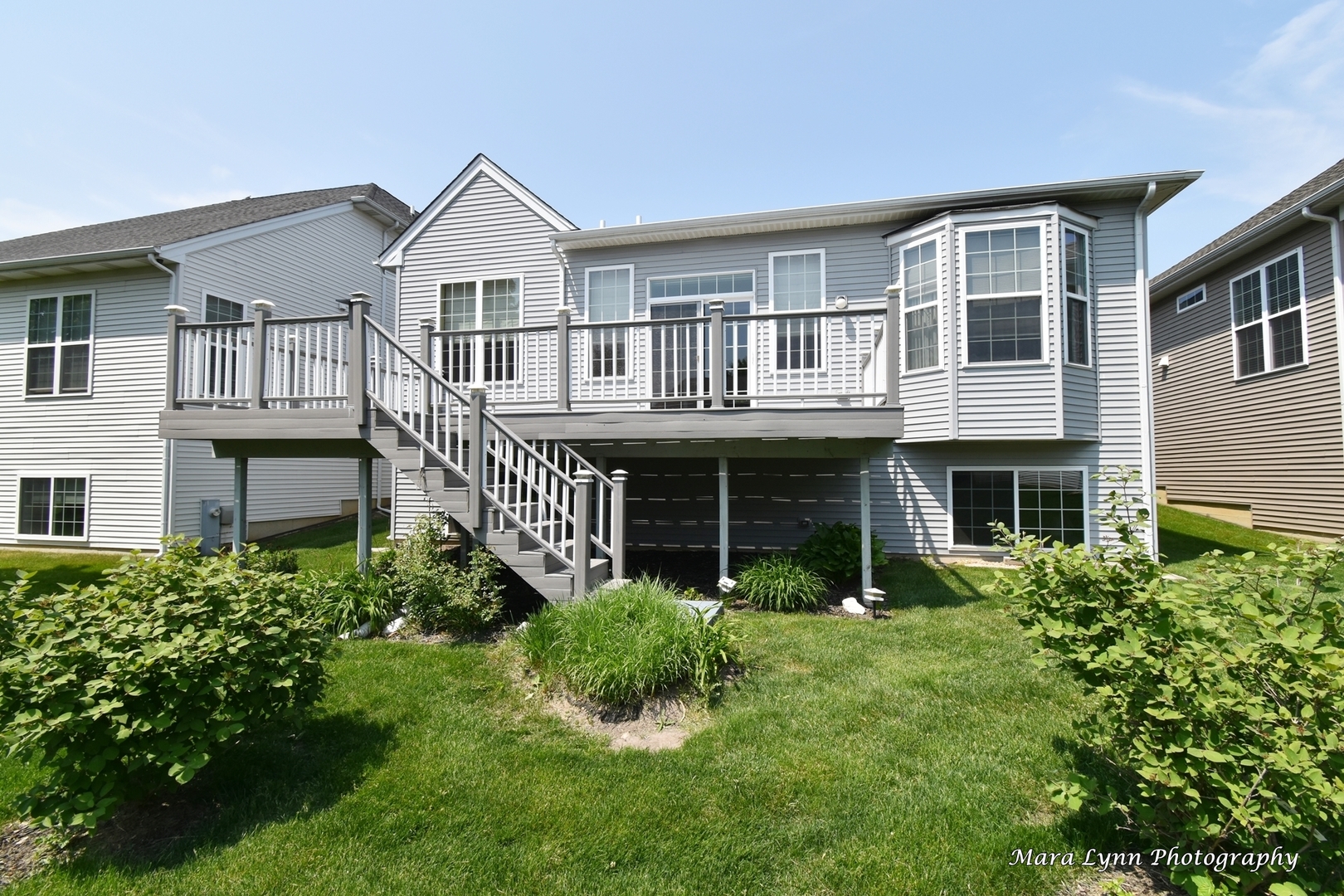 3881 Valhalla Drive Elgin, IL 60124 - Photo 32 of 39 a front view of a house with a yard and porch
