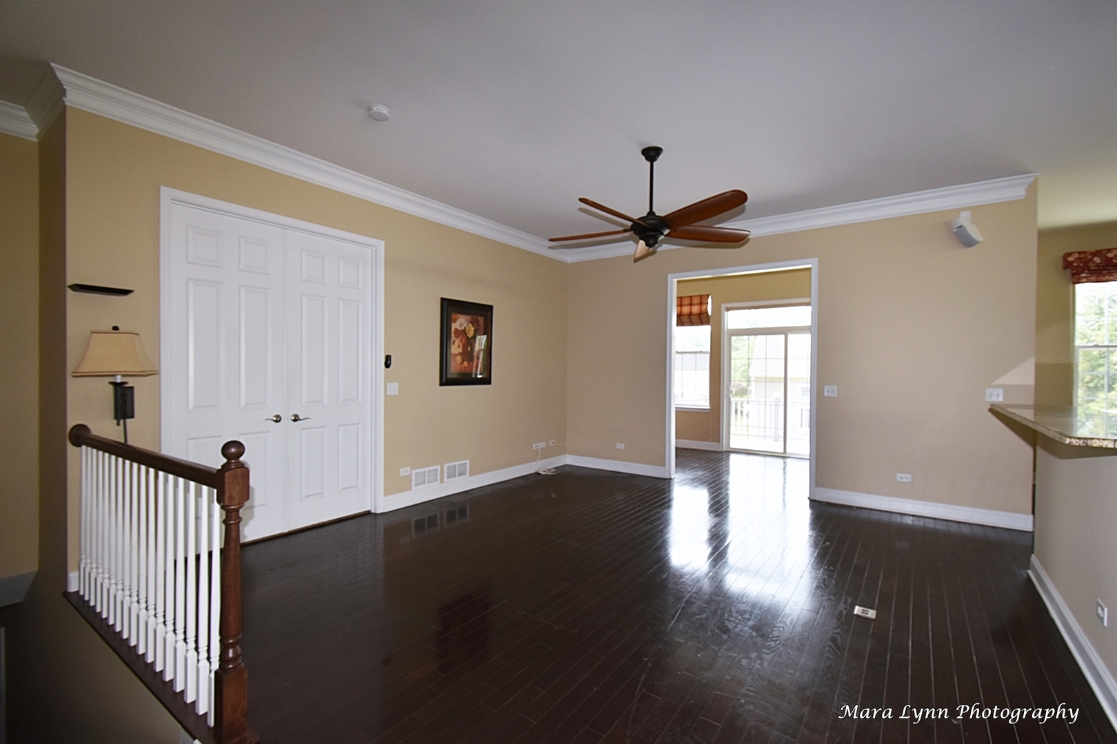 3881 Valhalla Drive Elgin, IL 60124 - Photo 33 of 39 a view of a hallway with wooden floor and a ceiling fan