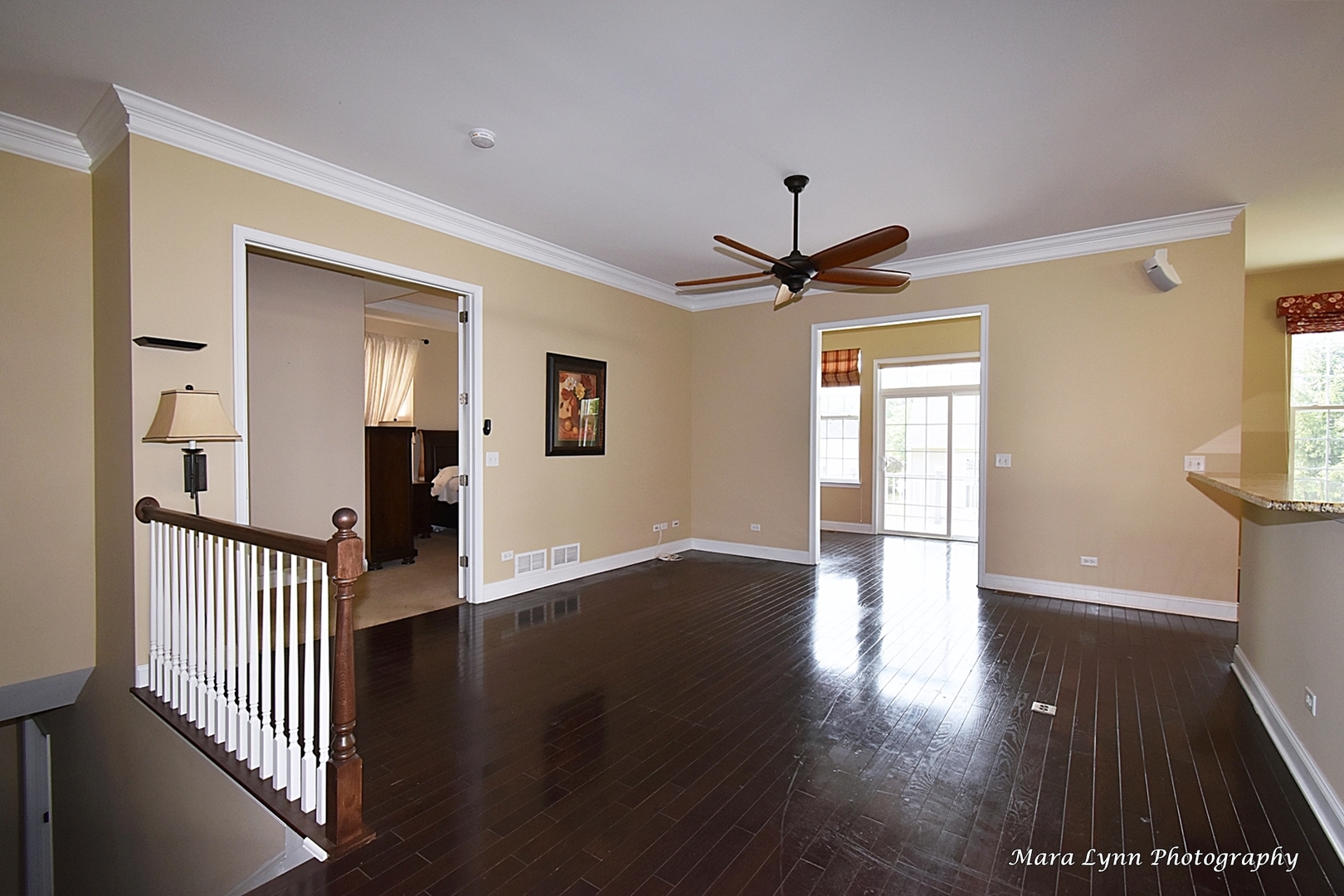 3881 Valhalla Drive Elgin, IL 60124 - Photo 5 of 39 a view of a hallway with wooden floor and a ceiling fan