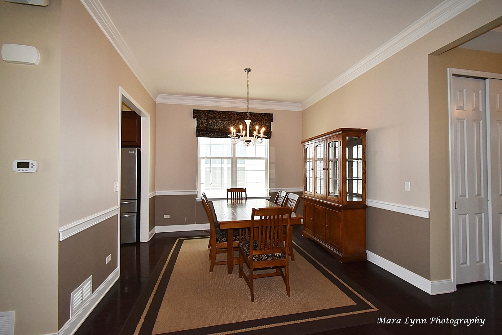 3881 Valhalla Drive Elgin, IL 60124 - Photo 7 of 39 a view of a dining room with furniture window and wooden floor