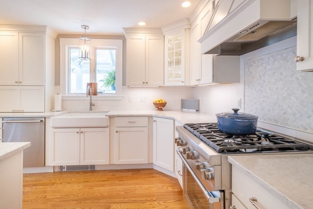 203 Samoset Avenue Hull, MA 02045 - Photo 16 of 39 a kitchen with stainless steel appliances granite countertop a sink stove and cabinets