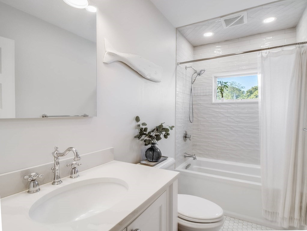 203 Samoset Avenue Hull, MA 02045 - Photo 27 of 39 a bathroom with a sink a toilet and shower