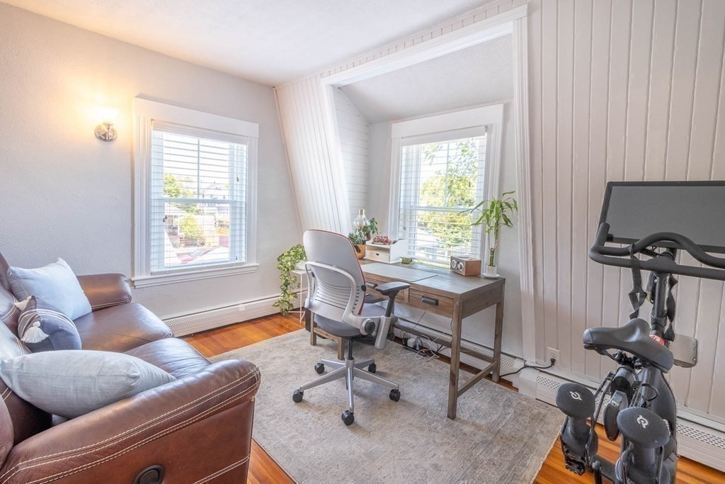203 Samoset Avenue Hull, MA 02045 - Photo 28 of 39 a living room with furniture a window and gym equipment