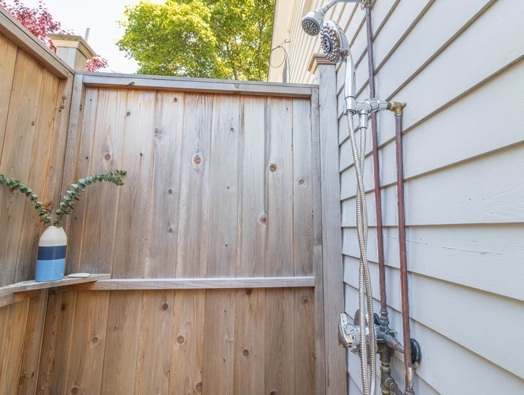 203 Samoset Avenue Hull, MA 02045 - Photo 33 of 39 a view of a house with a wooden fence