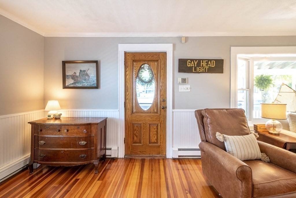 203 Samoset Avenue Hull, MA 02045 - Photo 8 of 39 a living room with furniture and a wooden floor