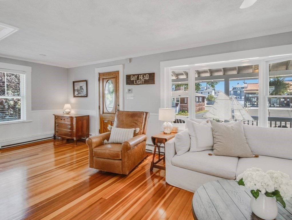 203 Samoset Avenue Hull, MA 02045 - Photo 9 of 39 a living room with furniture and a wooden floor