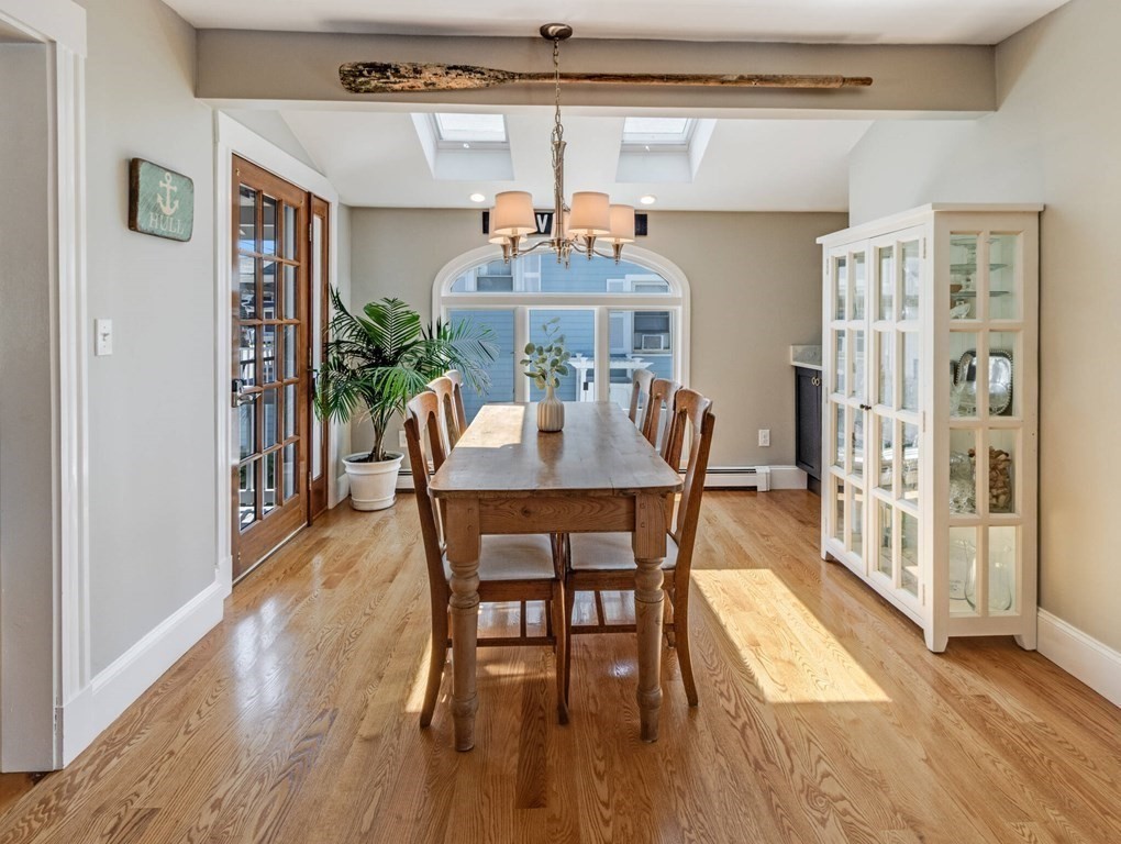 203 Samoset Avenue Hull, MA 02045 - Photo 10 of 39 a view of a dining room with furniture and wooden floor