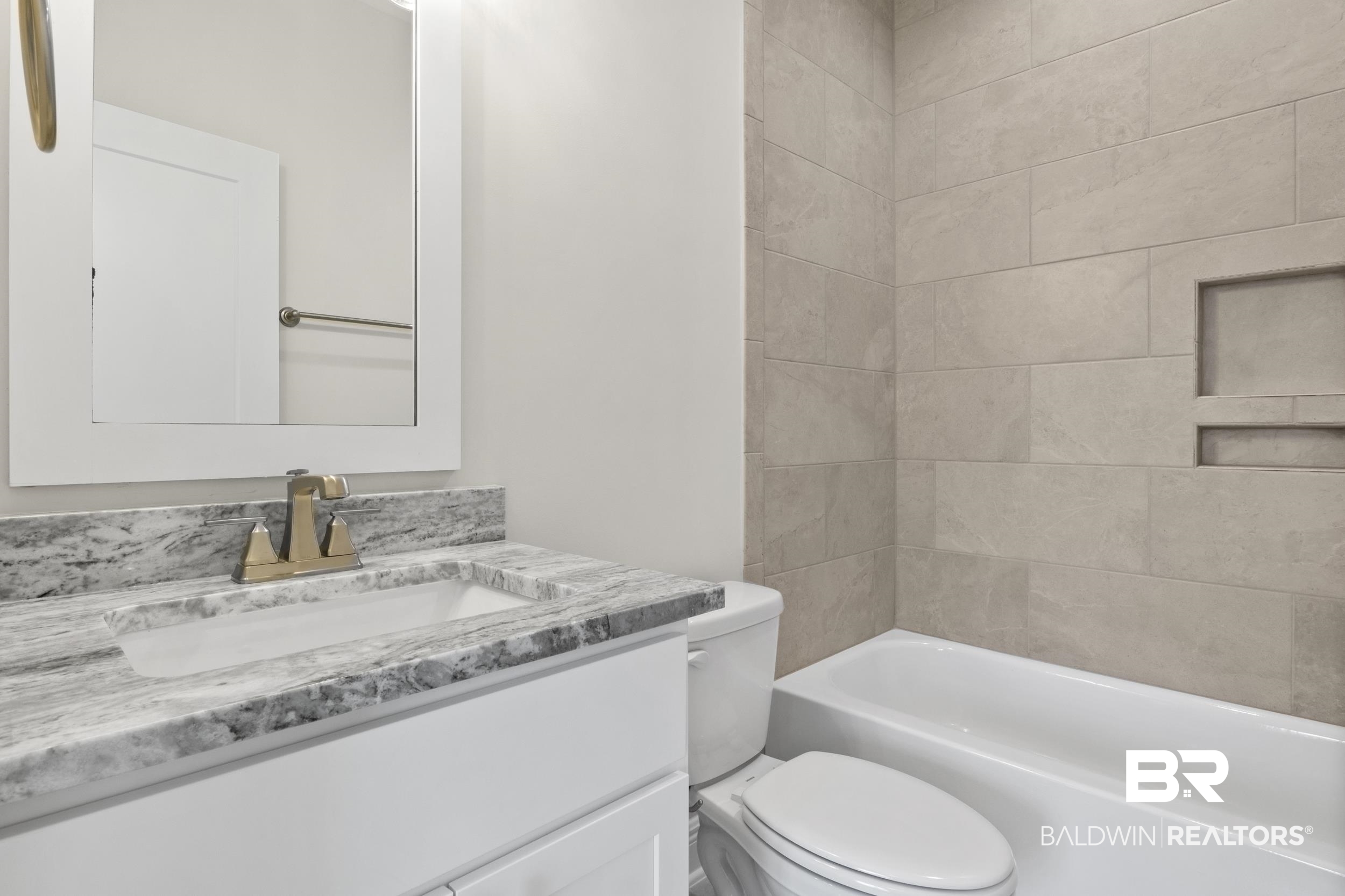 2847 Salt Drive Orange Beach, AL 36561 - Photo 24 of 29 Full bathroom featuring vanity, toilet, and tiled shower / bath