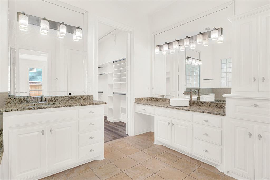 5729 Ridgehaven Drive Plano, TX 75093 - Photo 10 of 21 a bathroom with a granite countertop sink two mirror and a shower