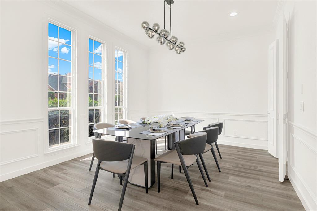 5729 Ridgehaven Drive Plano, TX 75093 - Photo 3 of 21 a view of a dining room with furniture windows and wooden floor