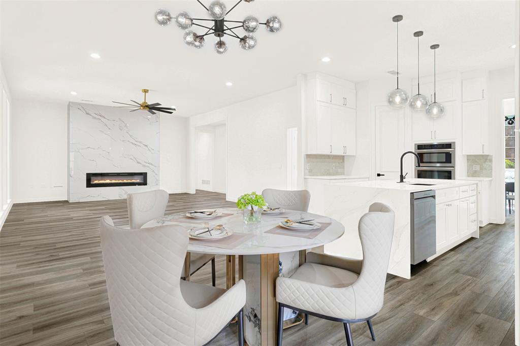 5729 Ridgehaven Drive Plano, TX 75093 - Photo 21 of 21 a view of a dining room with furniture and wooden floor