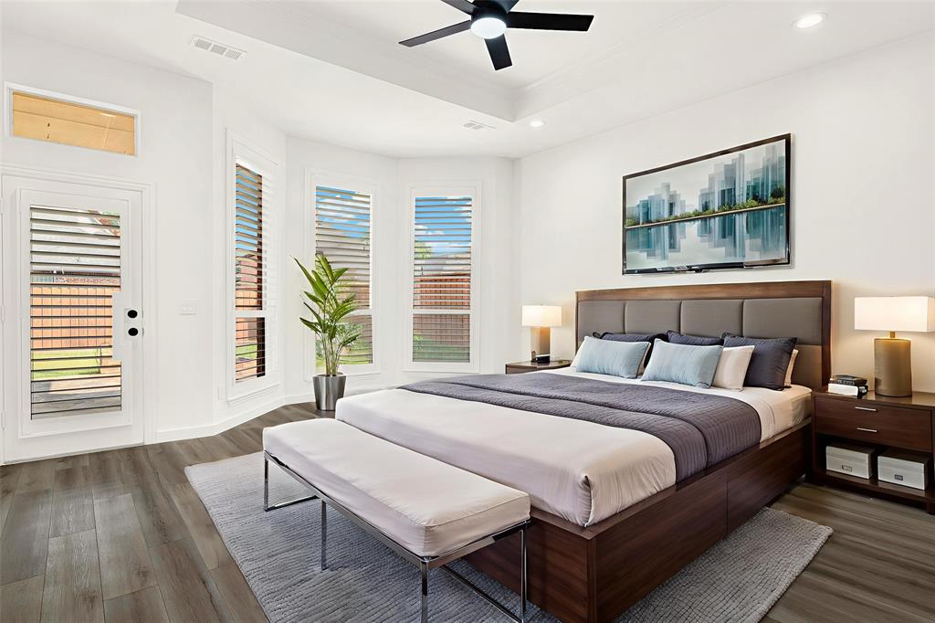 5729 Ridgehaven Drive Plano, TX 75093 - Photo 9 of 21 a bedroom with a bed and a large window