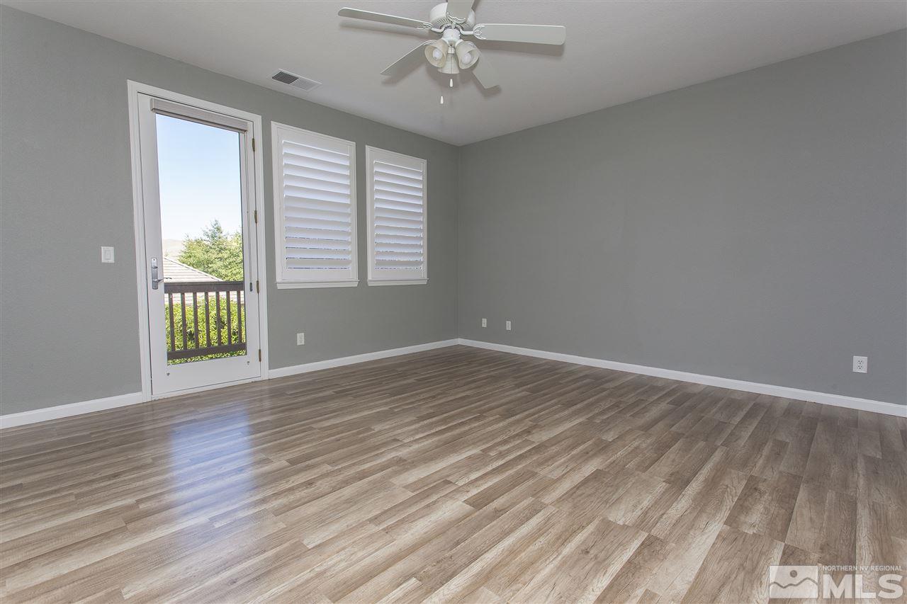 581 Alydar Court Reno, NV 89521 - Photo 14 of 22 wooden floor in an empty room with a window