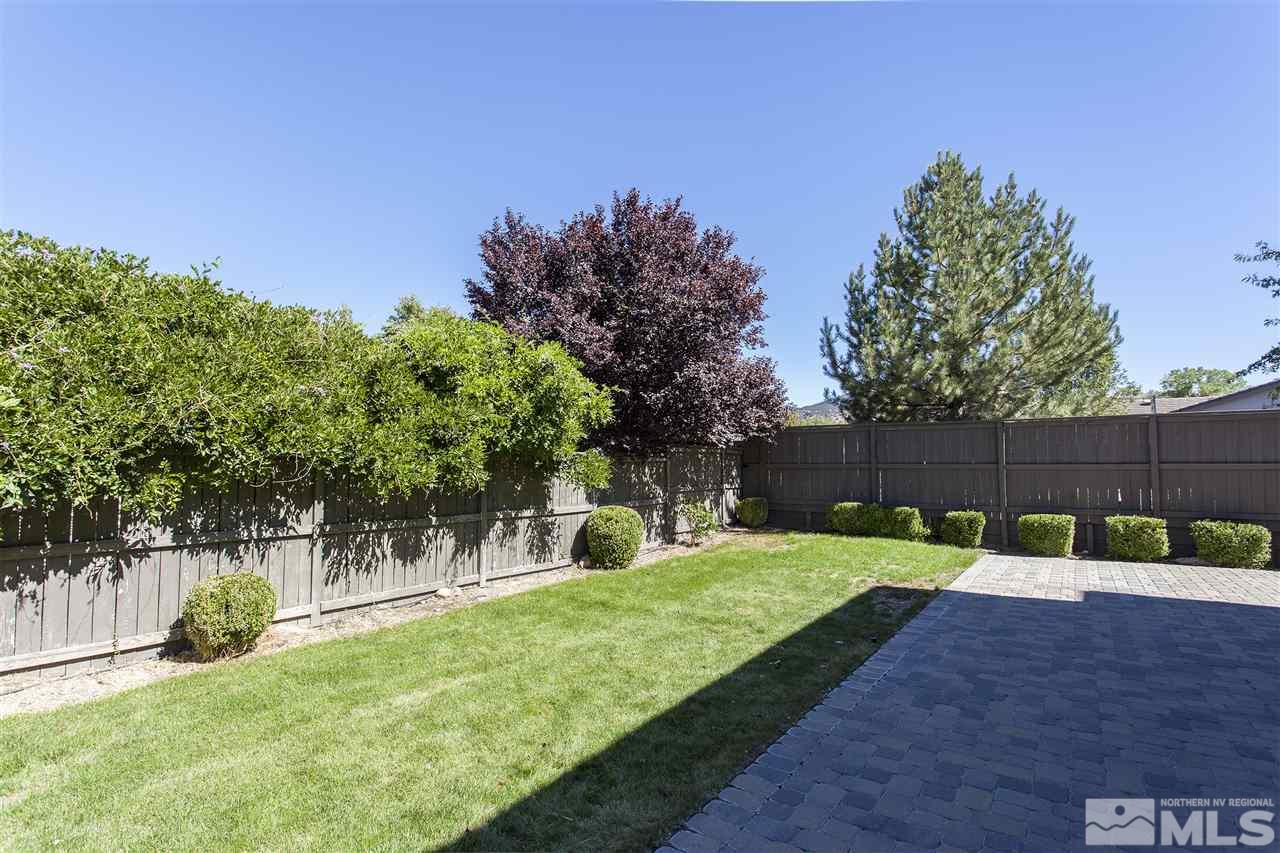 581 Alydar Court Reno, NV 89521 - Photo 22 of 22 a view of a yard with a tree
