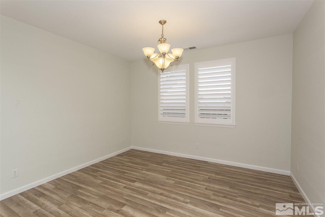 581 Alydar Court Reno, NV 89521 - Photo 7 of 22 a view of a chandelier in a room