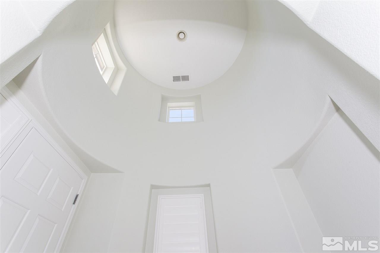 581 Alydar Court Reno, NV 89521 - Photo 10 of 22 a view of a livingroom with wooden floor and a large window