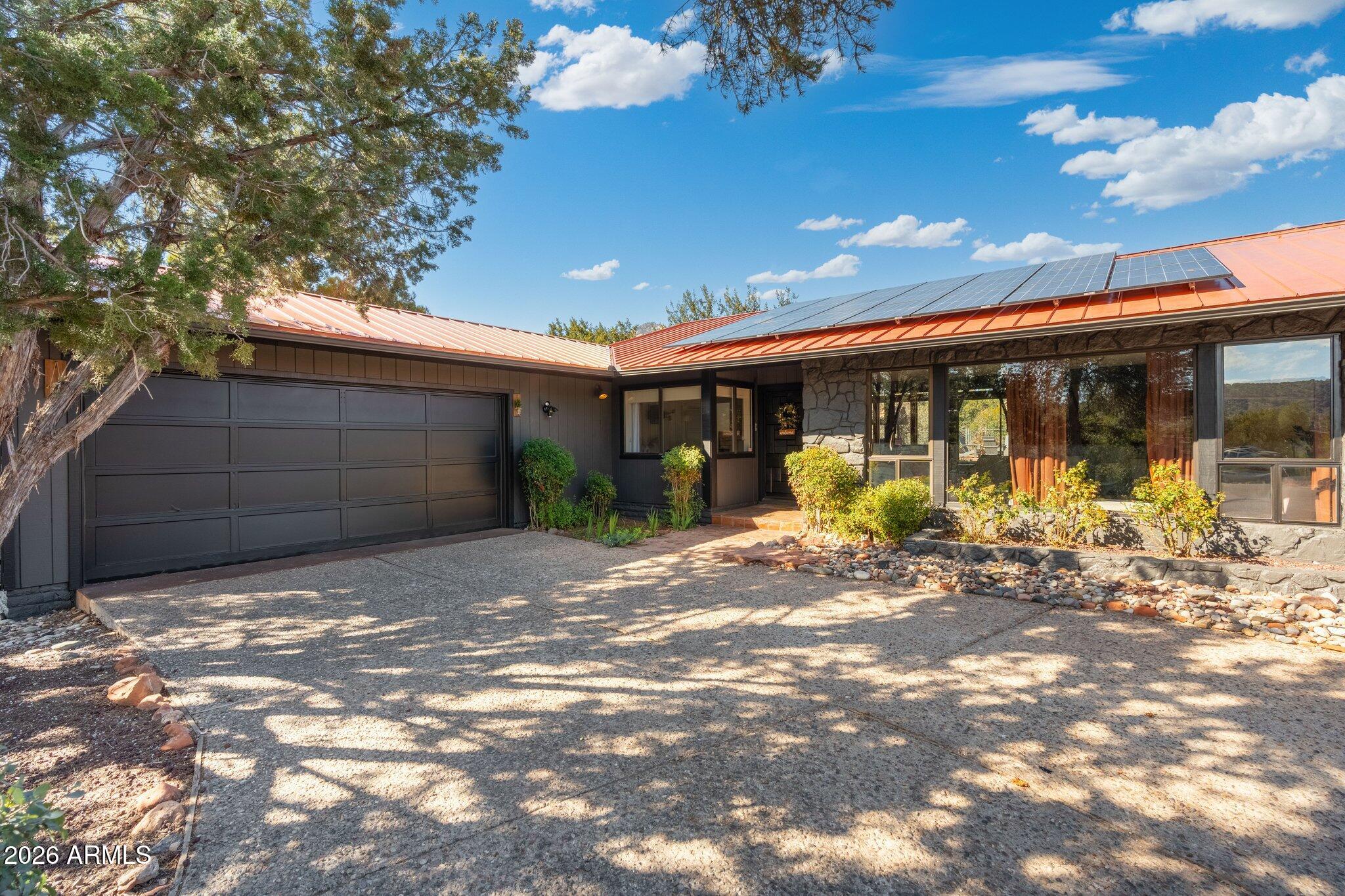 40 Mission Road Sedona, AZ 86336 - Photo 1 of 75 a view of a house with outdoor space and sitting area