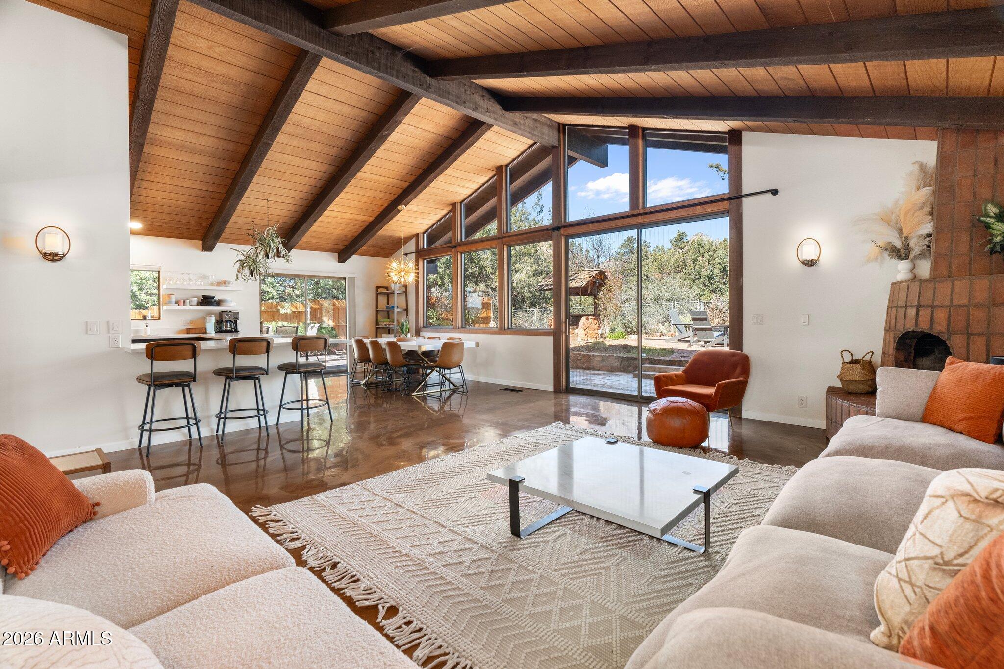 40 Mission Road Sedona, AZ 86336 - Photo 17 of 75 a living room with furniture and a large window