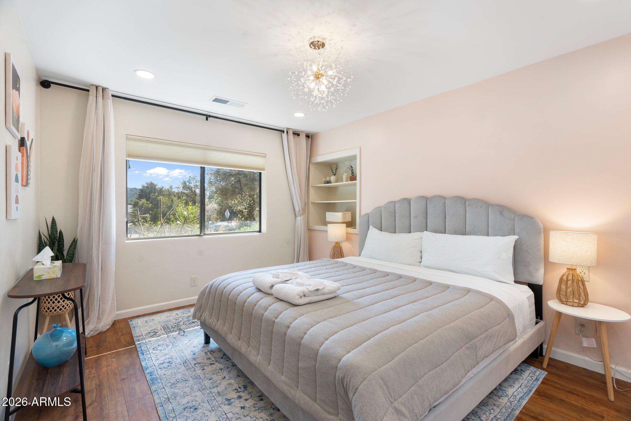 40 Mission Road Sedona, AZ 86336 - Photo 37 of 75 a bedroom with a large bed and a window