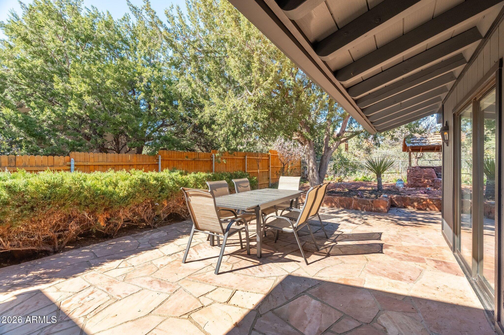 40 Mission Road Sedona, AZ 86336 - Photo 51 of 75 a view of a patio with table and chairs and potted plants